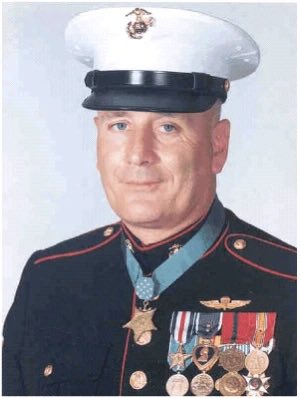 MilitaryCooI's tweet photo. On this day, July 27, 1929, future Medal of Honor recipient Jimmie Earl Howard was born in Burlington, lowa.

Howard enlisted in the United States Marine Corps in July 1950 and first experienced combat during the Korean War, where he served as a forward observer with the 1st Marine Division. He was wounded three times and received the Silver Star.

In April 1966, Staff Sergeant Howard deployed to South Vietnam as the leader of an 18-man reconnaissance platoon from Company C, 1st Reconnaissance Battalion, 1st Marine Division.

In June, Howard and his Marines established an observation post on Hill 488 near Chu Lai, deep inside enemy-controlled territory. Shortly before midnight on June 16, an estimated battalion-sized Viet Cong force launched a massive attack against the isolated patrol.

Facing overwhelming odds, Howard organized his Marines into a tight defensive perimeter and moved from position to position, calmly directing their fire.

Grenade fragments struck Howard in the back and temporarily prevented him from using his legs. He refused morphine because he feared it would make him drowsy and unable to continue commanding his men.

When the Marines began running out of grenades, Howard told them to throw rocks toward the enemy. Believing the rocks were explosives, enemy soldiers exposed themselves and were met by Marine rifle fire.

Howard continued directing supporting aircraft, distributing ammunition and encouraging his wounded Marines throughout the night.

By sunrise, five Marines had been killed and every surviving member of the platoon had been wounded, but Hill 488 remained in American hands.

President Lyndon B. Johnson presented Howard with the Medal of Honor at the White House on August 21, 1967.

Jimmie Howard retired from the Marine Corps in 1977 and died on November 12, 1993. Today, on his birthday, we remember the leadership and courage that helped save his platoon against overwhelming odds.