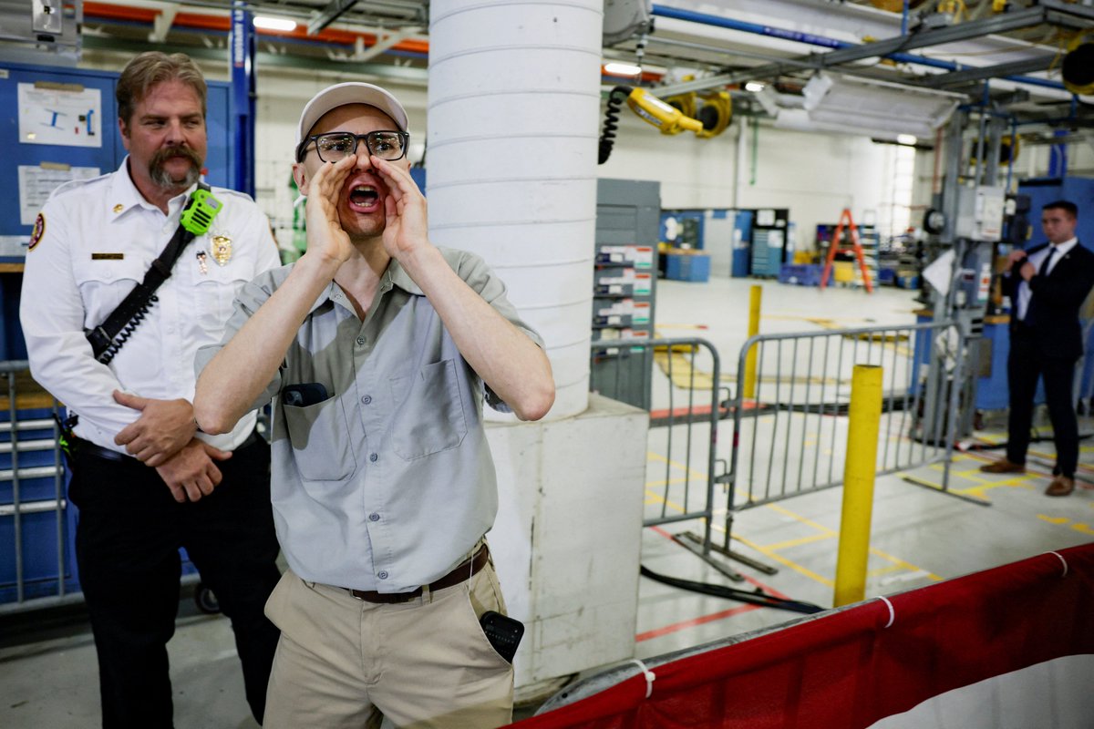 MeidasTouch's tweet photo. A protester interrupts by yelling "pedophile" as U.S. President Donald Trump delivers remarks during an event at the General Motors Milford Proving Ground in Milford, Michigan, U.S., July 27, 2026. REUTERS/Evan Vucci https://t.co/UU1r15KbFk