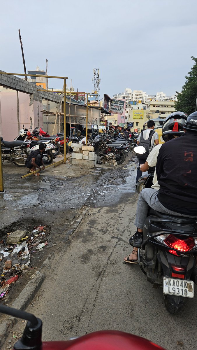cheleswer's tweet photo. In Nallurahalli Whitefield, opposite to Brigade IRV building, the bike repairing shop encroaching the footpath spilling water on road ,people have no place to walk and forced to walk on the main road.  @BBMPSWMSplComm @Nallurahalli @krishnabgowda @WFRising  please take action. https://t.co/rtV5JgrBFI