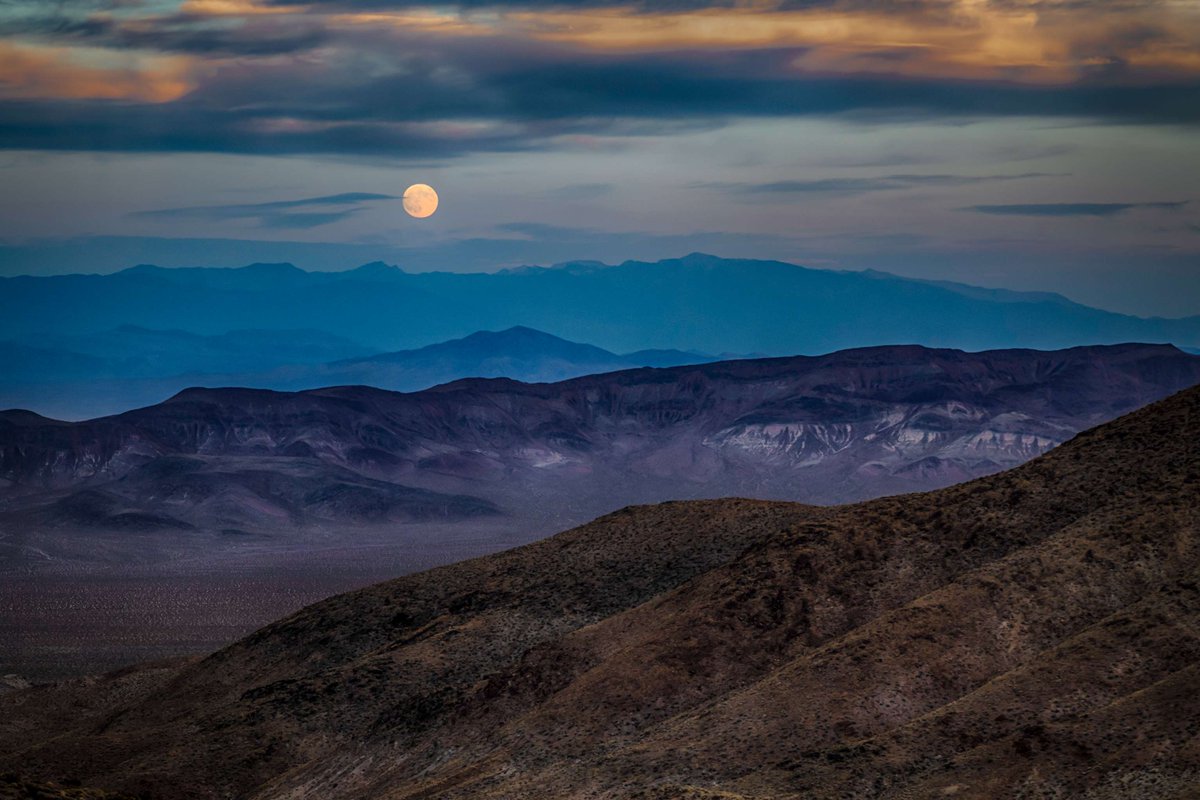 Interior's tweet photo. Hey, look up. 🌕 

On July 29, the full Buck Moon will light up the night sky. 

Named for the time of year when male deer begin growing new antlers, July's full moon is a good reminder to step outside, slow down and spend a little time gazing at the night sky. 

Photo of full moon rise over Death Valley National Park by Tom Morris