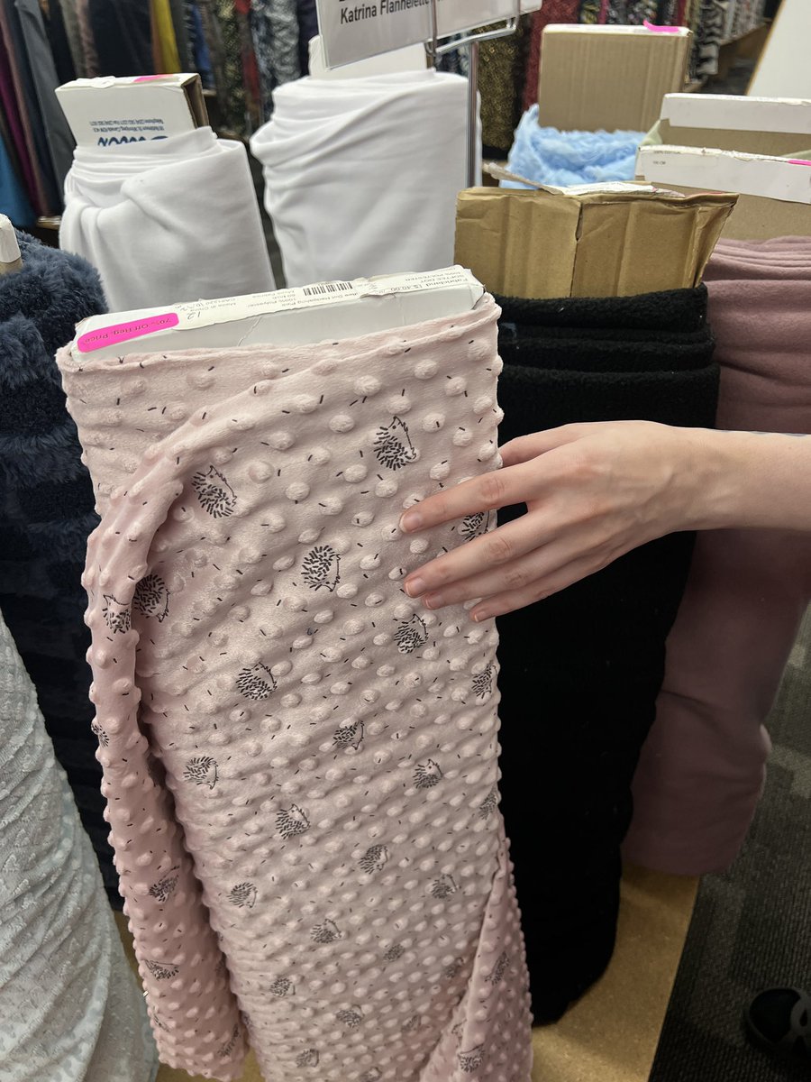 ithriftedthat's tweet photo. at the fabric store with my seastar;
“ooo, there’s little hedgehogs on it…”
“on the dimple minky!” https://t.co/dWv1Ai128O