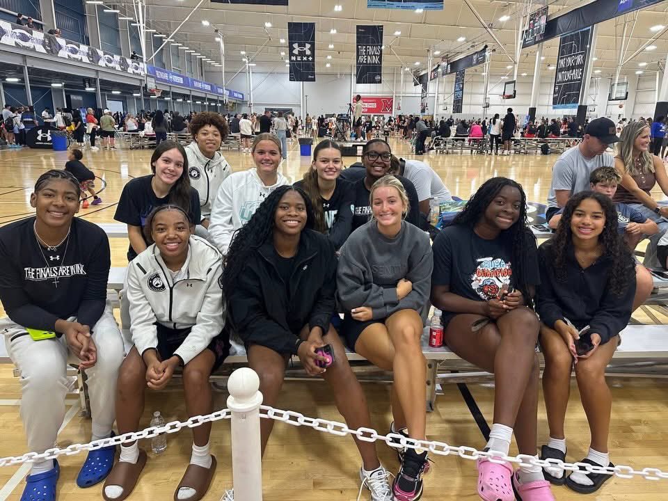 Brian_Mallory's tweet photo. Want to see what the culture looks like that @Scottejohnson12 has built? Just look at this photo. 

This is his 17u team, arguably the top 17u team in the country, sitting behind the bench of his 15u team in their championship game the morning after they got beat in the 17u semis ending their season. These girls didn’t have a game today and stayed around to support the next generation.