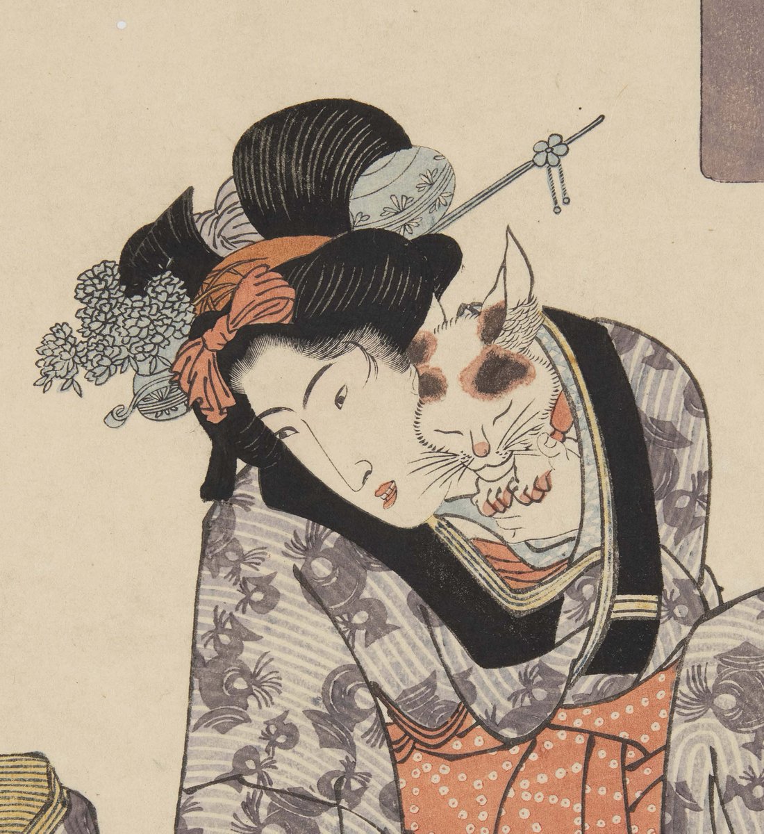 ある寒い冬の日、猫は炬燵に入らず、女性の懐の中に入ってぬくぬく