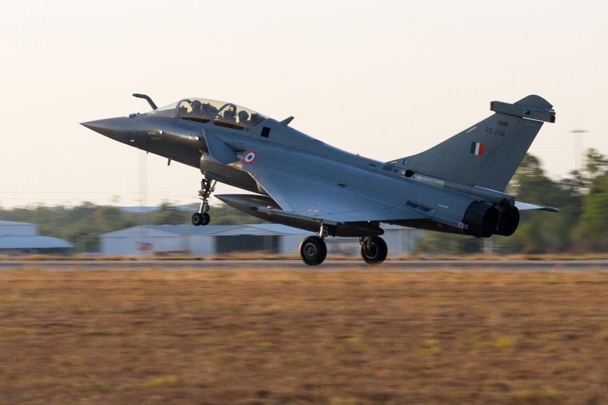 IAF_MCC's tweet photo. The Indian Air Force contingent is actively engaged in #ExercisePitchBlack 2026 alongside the Royal Australian Air Force and Air Forces from 20 nations.

A spectacular Rafale flypast over Darwin's iconic Mindil Beach marked the opening of the exercise. The IAF contingent also clinched Gold in the multinational football tournament.

Training Together.
Integrating Seamlessly.
Flying Stronger.

#IndianAirForce #Rafale #RAAF #AirPower #Interoperability

@DefenceMinIndia
@SpokespersonMoD
@HQ_IDS_India
@adgpi
@indiannavy
@CareerinIAF
@cgisydney
@AusAirForce