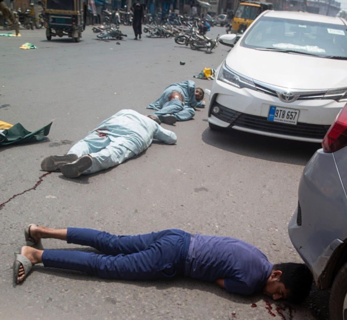 erbmjha's tweet photo. Look at this picture. Internalise it. 12 lives gone. 

Unarmed protestors killed by Pakistani army. 

Why is no one talking about this ??? https://t.co/mrO9ho1u5S