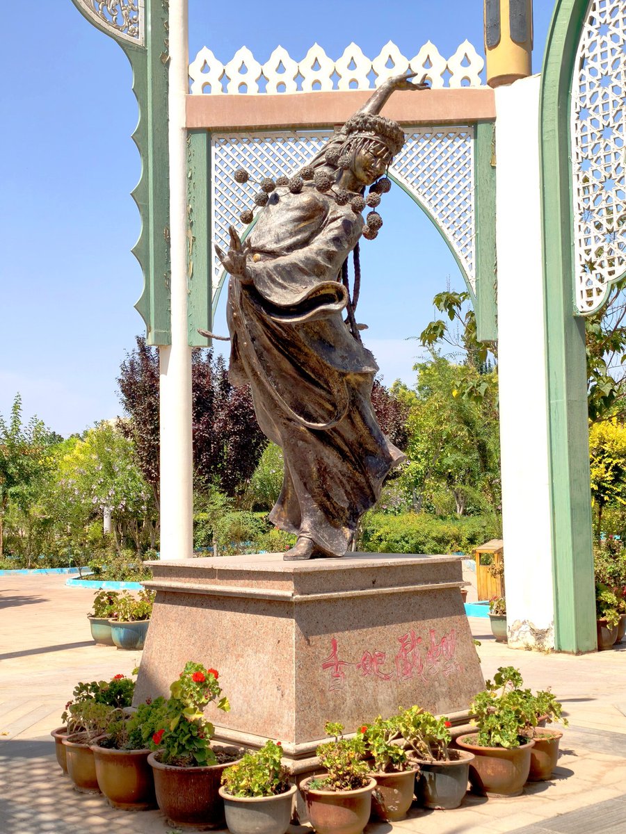 Forepeak60's tweet photo. Outside the 17th-century Afaq Khoja Mausoleum in Kashgar, the burial site of the Afaq Khoja family, a prominent dynasty of Sufi religious leaders. One of the mausoleum's most celebrated figures is associated with the woman known in Chinese history as "Xiang Fei" (see her statue in the last photo), meaning "Fragrant Concubine." According to Qing-era legend, she possessed a naturally sweet fragrance that was said to attract butterflies, a story that became an enduring part of Chinese folklore.