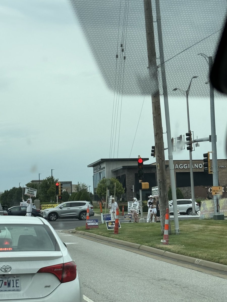 KCSportsBurner's tweet photo. Circumcision protest on 135th and Metcalf for anyone interested https://t.co/ElMwCVBlzz