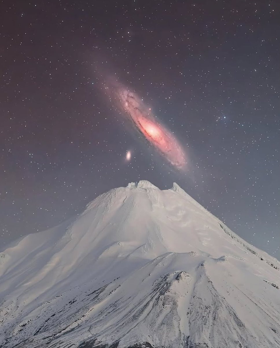 NightSkyToday's tweet photo. The Stunning Andromeda Galaxy captured above a mountain peak, glowing clearly in the night sky. This rare shot reveals our nearest major galaxy shining 2.5 million light-years away, perfectly aligned above the landscape — a breathtaking blend of Earth and the cosmos.😍 https://t.co/KrYhKo28bL