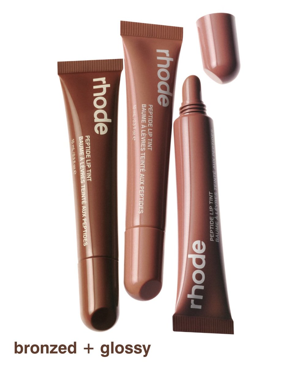 Rhodeskinrpg's tweet photo. Bronze + glossy 🥭🥥

get to know the limited edition summer peptide lip tints. each sun-warmed, bronzy shade melts onto lips with a hint of tint and a nostalgic summer scent. throw them in your terry bag or pop one in your lip case to hydrate, nourish, and replenish on the go. https://t.co/PxPuH6G0I7