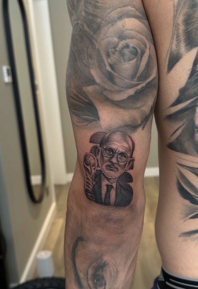 ElowencX's tweet photo. Marc Cucurella kept his promise :

Before the 2026 FIFA World Cup, he said that if Spain won the tournament, he would get a tattoo of Spain coach Luis de la Fuente's face. After Spain defeated Argentina in the final, Cucurella followed through and got the tattoo on his left arm. https://t.co/p5Qt30igH3
