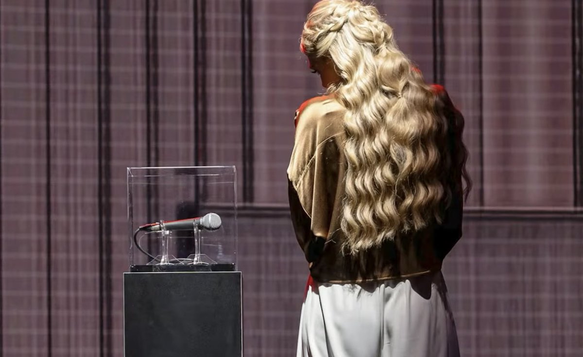 WildFlower1203's tweet photo. This was sick &amp; grotesque. Even her jewelry is gross &amp; weird. She made $ from his bloody mic, the tent he d*ed in &amp; the book HE wrote. Then, she gave his “security,” raises &amp; let the other 🤡’s turn his show into a circus. 
Applause, Applause, Erika Kirk. 😡 https://t.co/fm4lLWKQdn