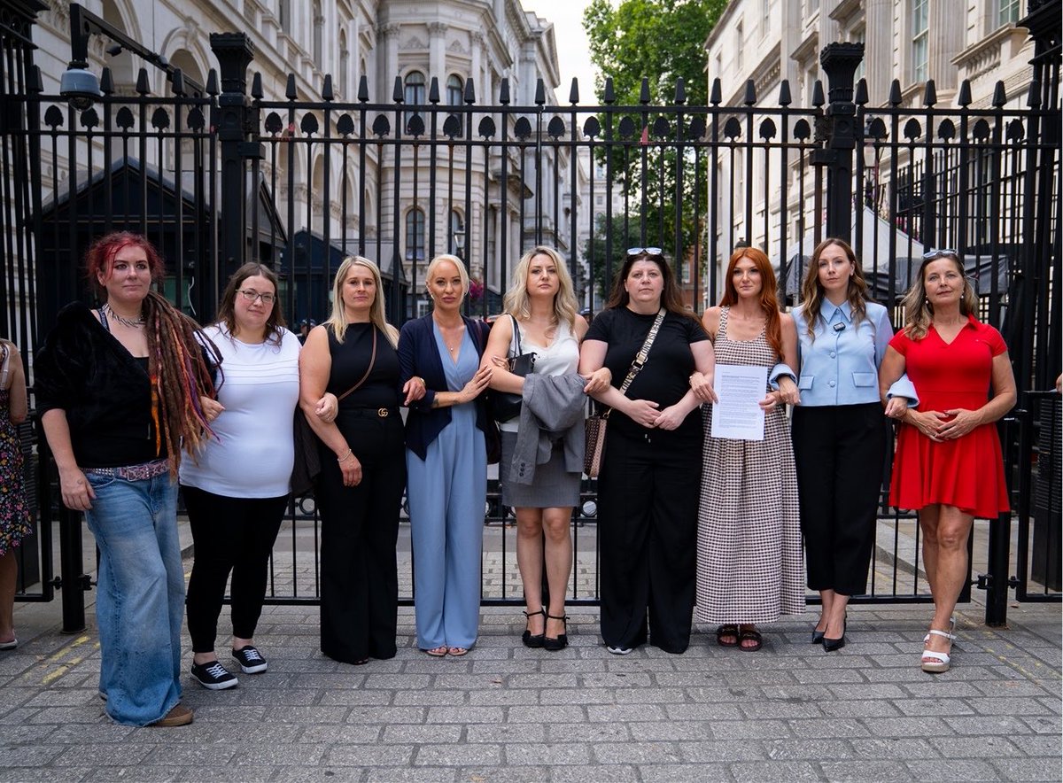 CDP1882's tweet photo. Child abuse victims linking arms outside Downing Street, where today they delivered a letter with solicitor Amy Clowrey urging Andy Burnham to recall Parliament and block the early release of their perpetrators. https://t.co/LK9auenEXJ