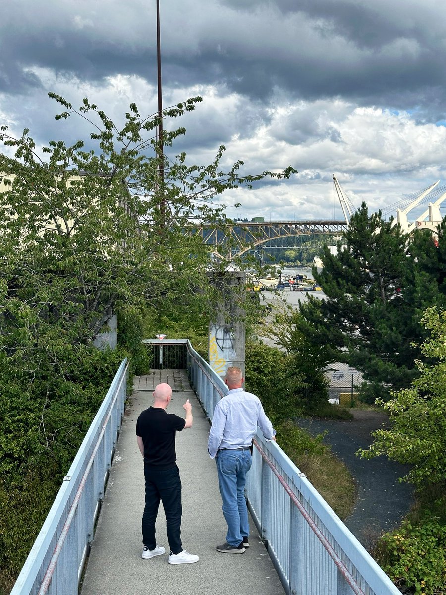 braedencaley's tweet photo. Tens of thousands cross the Ironworkers Memorial Bridge every day, named for the 19 workers who died when it collapsed mid-construction in 1958.

Today I met with Doug Parton of Ironworkers Local 97 (the union whose members built the bridge) along the Burrard waterfront, with so much of Canada's trade moving through the harbour right behind us.

We talked about building our economy strong in the face of global uncertainty: major projects that get to yes, apprenticeships that become high-paying union careers, and building in solidarity with Canadian workers. 

That's the mission of Mark Carney's team, and the work I want to take to the next level for the North Shore. Because a strong B.C. economy will get built one beam, one shift, and one skilled pair of hands at a time.