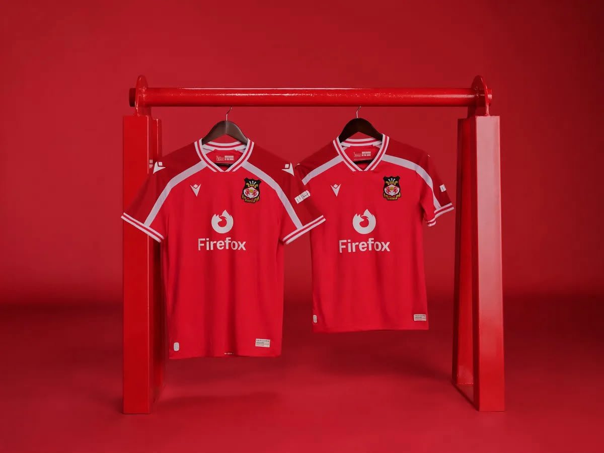 tudorgolf's tweet photo. When the theme of the new @Wrexham_AFC kit are the Kop barriers that my late grandad fabricated, welded and installed at the Racecourse with his company RMG Engineering 😢 Looking forward to seeing it in the flesh and kitting out my 2 lads 🔴⚪️ https://t.co/aFpOhtg5bo
