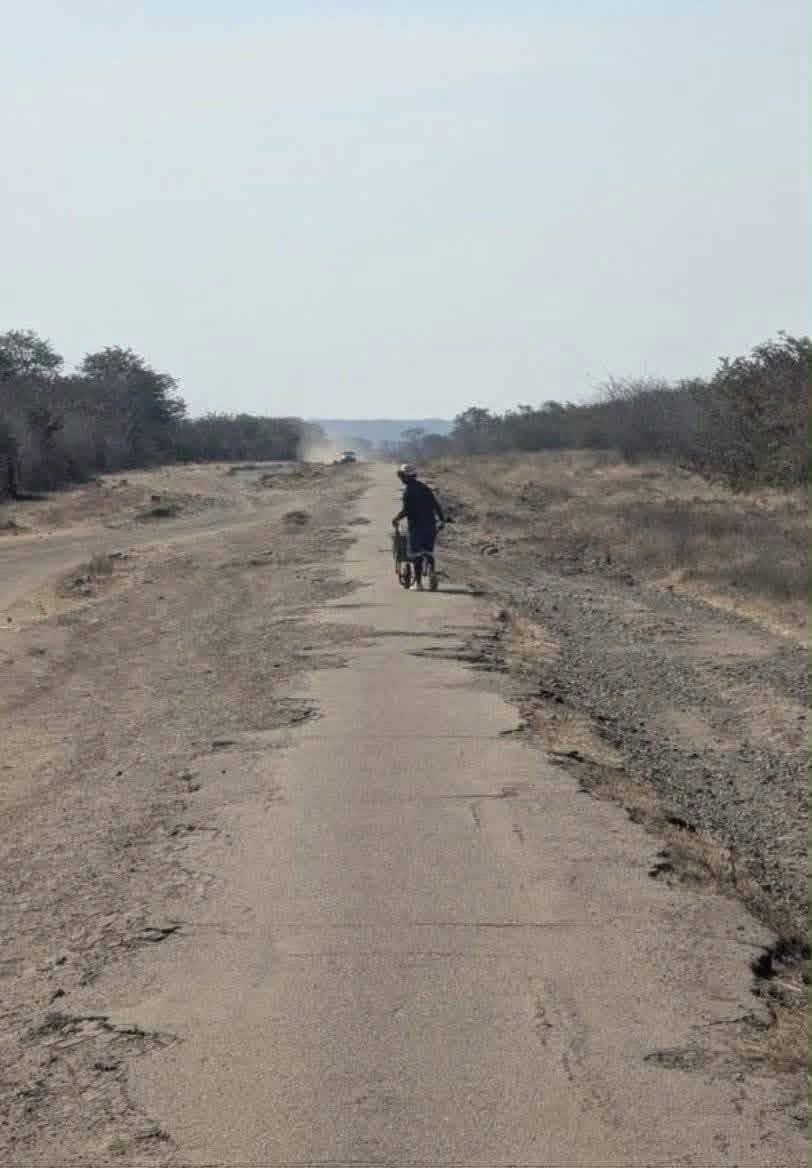 NgarivhumeJ's tweet photo. We go to sleep tonight with this painful reality. This is the Bulawayo���Victoria Falls Road—the gateway to one of the Seven Natural Wonders of the World. That a road leading to Victoria Falls can be left in such a deplorable state is simply #unbelievable. https://t.co/Wo627ovOyc