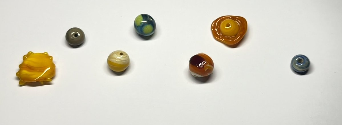 braceletladyy's tweet photo. my lil solar system beads all clean!! i still need to make mars and neptune but for now just pretend it's everything https://t.co/phOI7VkmxS