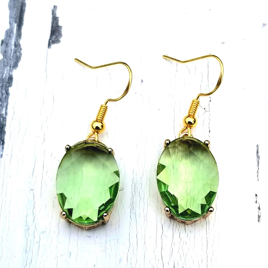 TrendingNowGift's tweet photo. 14k Gold Peridot Dangle Earrings #jewelry #earrings #dangleearrings #goldearrings #handmadejewelry #peridotearrings #peridotjewelry #peridot #Augustbirthstone #Augustbirthday #giftforher #bridal #wedding #etsy 

 https://t.co/orAQq1kpyI via @Etsy https://t.co/QtuZXbFdou