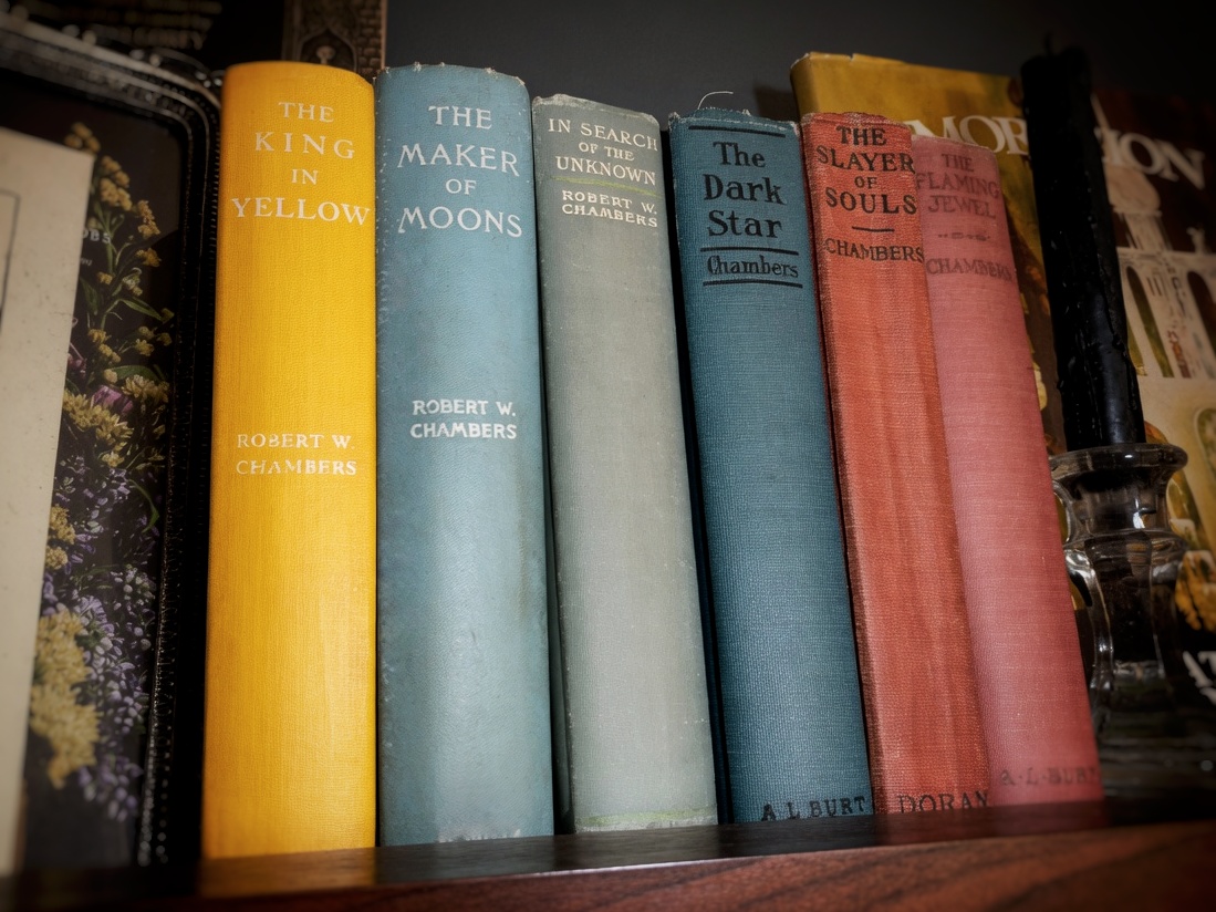 Weird_Friction's tweet photo. Some old Robert W. Chambers books on top of the bookcase. 📚 https://t.co/lf31a6nTcL