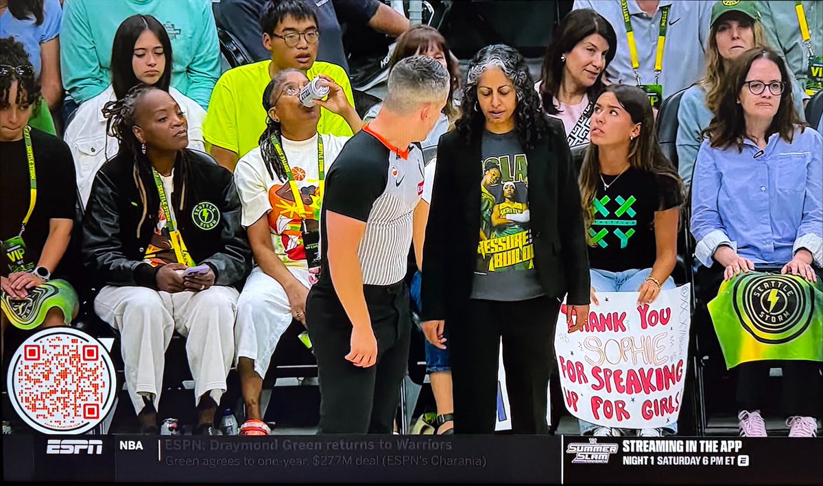 JonnyRoot_'s tweet photo. A Sophie Cunningham supporter is sitting courtside for the Storm vs Fever game in Seattle with a sign that says:

“Thank You Sophie For Speaking Up For Girls” https://t.co/oYk7Cm7pri