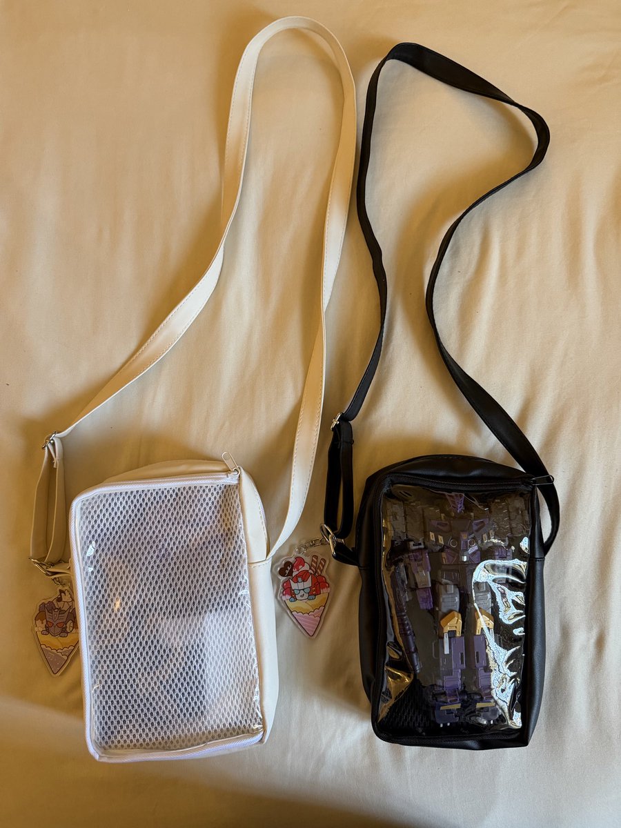scribescrawls's tweet photo. @circustroubles I sort of made my own Tarn and Pharma themed bags to carry my figure around by hand painting a bag I got from Daiso with the tf medic logo and Decepticon logo! I also designed some tote bags with this design I made :D https://t.co/lILbSTPnYu