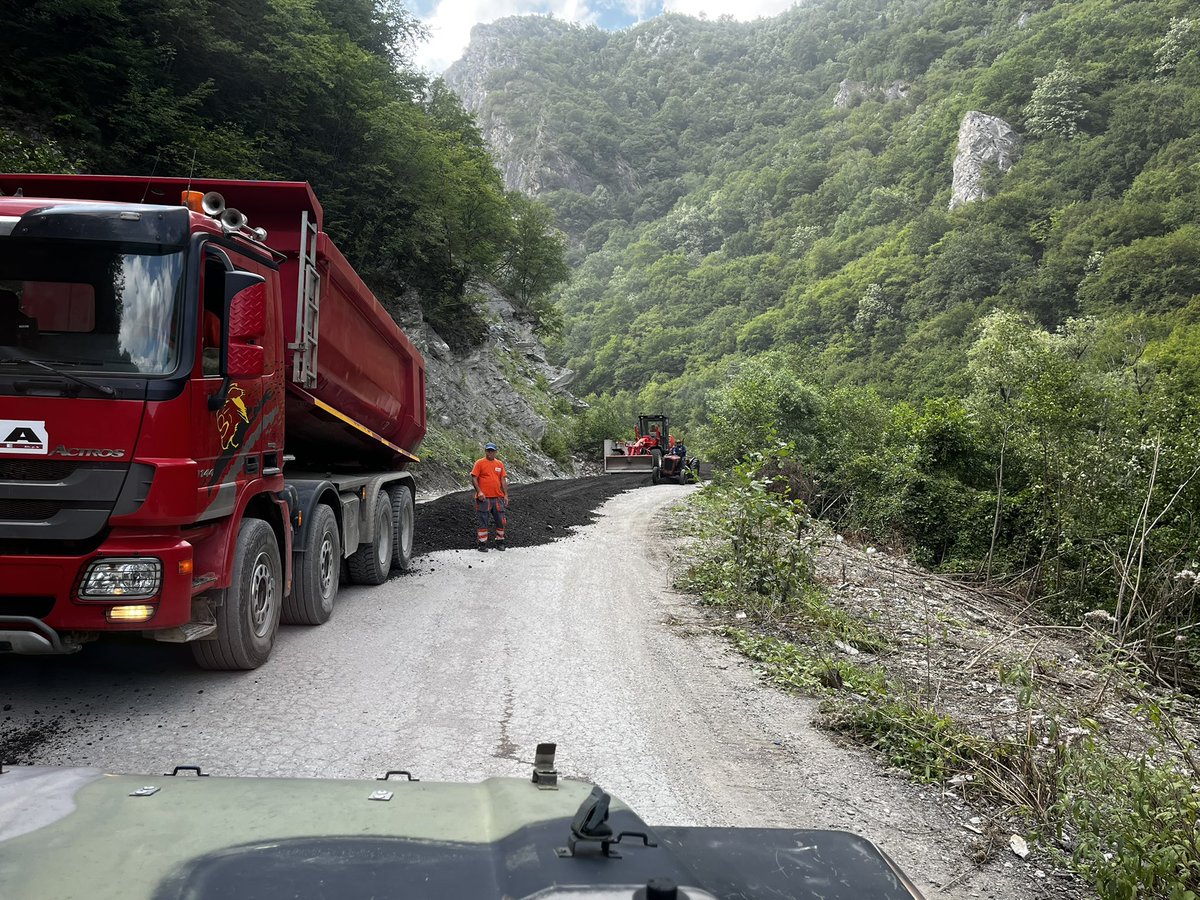 DecaniMonastery's tweet photo. URGENT‼️ Renewed works within the Special Protective Zone of the Visoki Dečani Monastery give rise to serious concern

Statement of the Serbian Orthodox Diocese of Raška and Prizren

https://t.co/xK2GYp7DXg

(1/2) The Diocese of Raška and Prizren has been informed that road works have once again commenced within the legally established Special Protective Zone of Visoki Dečani Monastery, approximately two kilometres west of the Monastery, along the existing alignment associated with the long-disputed project for the Dečani-Plav international transit road.
￼
Monks of Visoki Dečani Monastery visited the site where the works are being carried out. Heavy trucks were observed delivering substantial quantities of crushed stone, while construction machinery was spreading and levelling the material along the existing road alignment. By their nature and scale, the activities observed go beyond ordinary and limited road maintenance and bear the characteristics of construction, reconstruction or significant upgrading of road infrastructure within the protected area.

Neither Visoki Dečani Monastery nor the Diocese of Raška and Prizren was informed of these works in advance, nor were they provided with project documentation or an explanation of the purpose, scope and legal basis of the works. The agreement of the Serbian Orthodox Church, as required under the Law on Special Protective Zones, was not sought. Nor are we aware that the procedure prescribed by law has been initiated before the Implementation and Monitoring Council, in which, alongside two Kosovo ministers and Metropolitan Teodosije, the Heads of the EU and OSCE Missions in Kosovo also participate.
￼
Law No. 03/L-039 on Special Protective Zones constitutes the specific and binding legal framework for the protection of Visoki Dečani Monastery. Article 7 of the Law expressly establishes the Special Protective Zone of the Monastery. Article 5 explicitly prohibits the construction of transit roads through rural Special Protective Zones, such as that of Visoki Dečani Monastery, while Article 6 provides that any road construction or reconstruction works constitute restricted activities for which the competent authorities must first seek the agreement of the Serbian Orthodox Church. If agreement is not reached, the matter must be considered within the legally established implementation and monitoring mechanism.
￼
The legal position is therefore clear, irrespective of how the works may formally be described. If their purpose is to continue the construction of the Dečani-Plav transit route through the Special Protective Zone, they concern an activity prohibited by law. If the works are presented as the repair or improvement of the existing local road, they nevertheless remain subject to the requirement of prior consultation and agreement with the Church, as well as consideration by the competent joint mechanism if no agreement is reached. According to the facts currently available, none of these procedures has been followed, while the scale of the works exceeds ordinary seasonal repairs.

It is particularly concerning that this is not the first attempt to carry out works along the same or a connected route without full compliance with the law. Similar works within the Special Protective Zone commenced in 2018 and again in 2020, but were suspended following a decisive response by international representatives. 👇

#SerbianOrthodoxChurch in #Kosovo