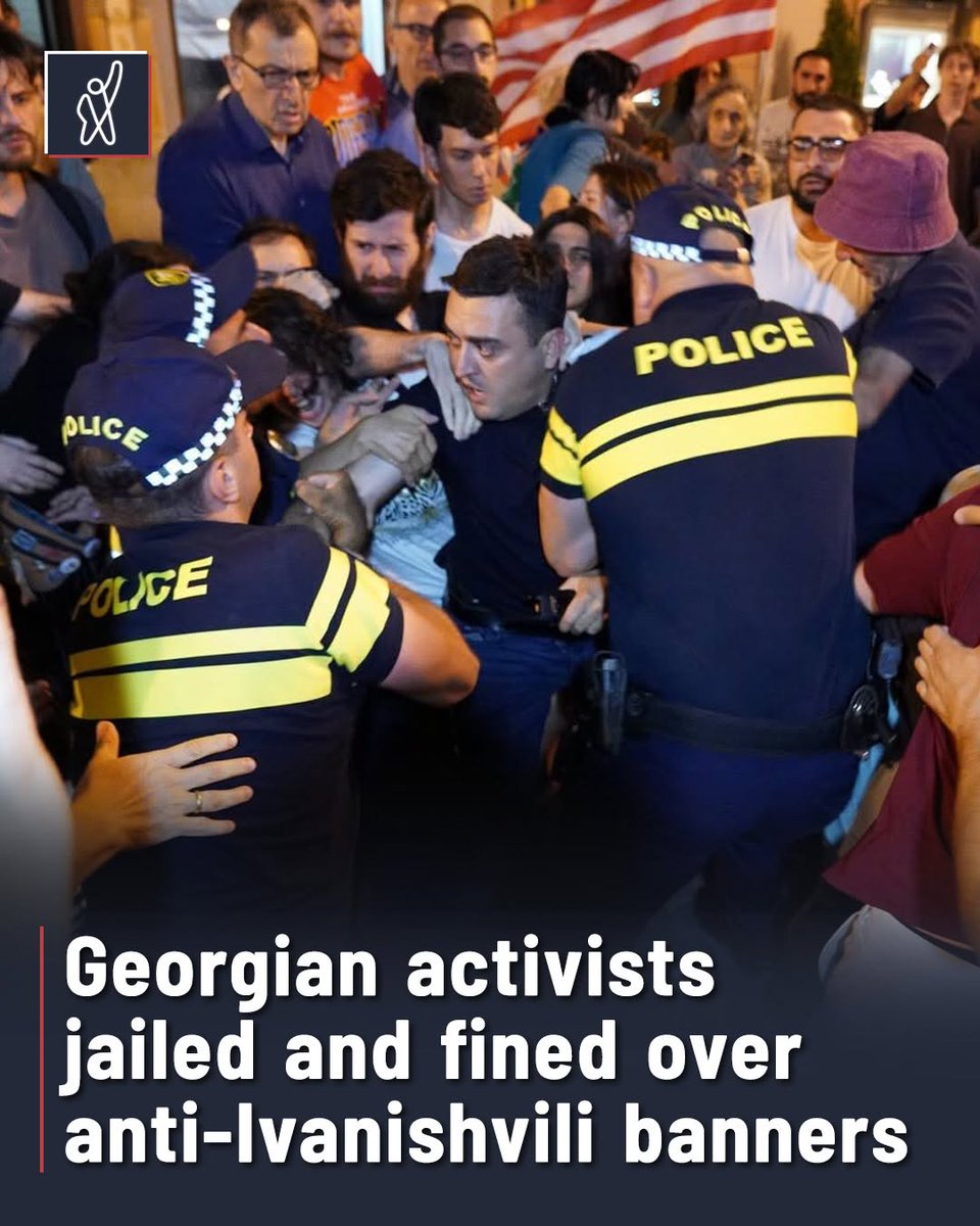 FormulaGe's tweet photo. A Tbilisi court has sentenced several activists to administrative detention and fined others after police detained them near the Tbilisi City Council over banners insulting Georgian Dream founder Bidzina Ivanishvili.

The late-night hearings ended at around 2 a.m. on July 29. The detainees had been arrested on July 26 after activist Tornike Toshkhua stood outside the council building holding a banner reading: “Is Bidzina a d***? Yes – No.” Others later arrived in solidarity with similar banners and were also detained.

Judge Zviad Tsekvava fined Toshkhua 3,000 GEL and imposed fines of 5,000–6,000 GEL on several others. Nato Bolkvadze received five days in detention, while Shako Baghdoshvili and Lasha Dgebuadze were each sentenced to 10 days.

In a separate ruling, Judge Tornike Kapanadze fined Vaso Beridze 5,000 GEL and sentenced Ia Melitauri to five days in detention. Melitauri reportedly told the court she had been mistreated after her arrest and showed injuries she said were sustained during detention.