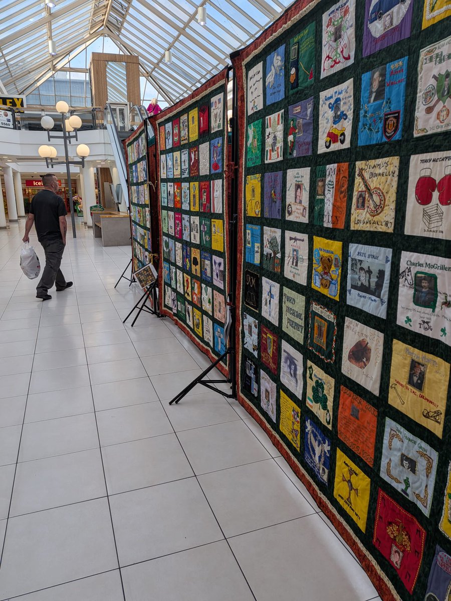 RelsForJustice's tweet photo. The Remembering Quilt being set up by our A Team in the Kennedy Centre.
Remembering over 500 victims of the conflict, each square is created by their families. 
A testimony to love and memory it will be on display until Friday 7th August https://t.co/hXujWVjZTs