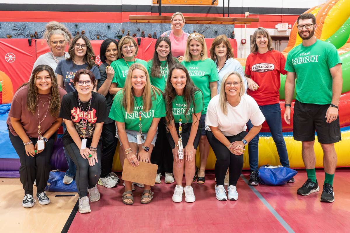 TCSPublic's tweet photo. This past Friday, East Lincoln staff members were sorted into their houses after they drew a Golden Eagle egg. From there, staff members headed to the top of an inflatable slide, revealed their house, then slid down. https://t.co/Y69HVEFAM7