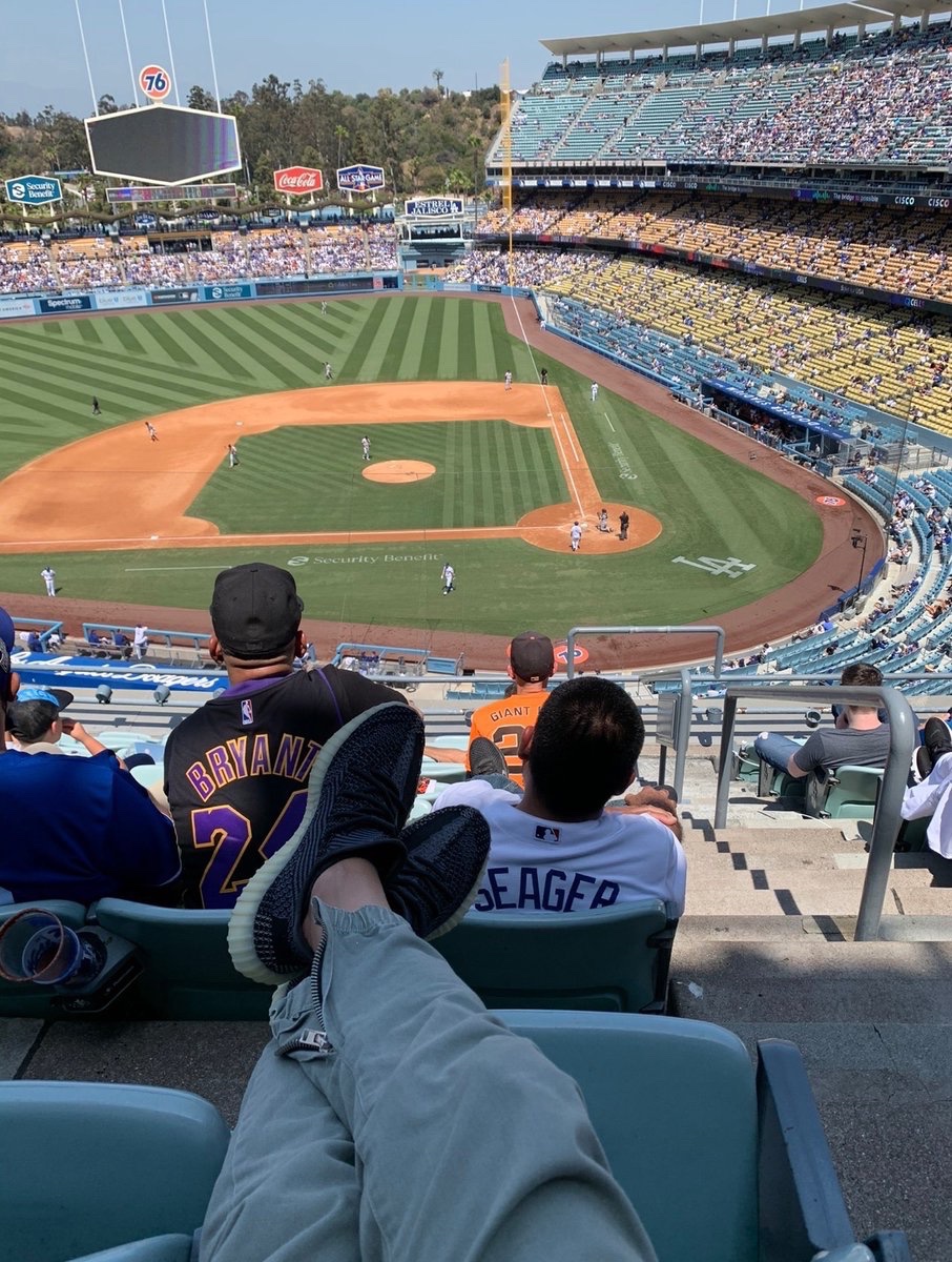 JLASHonX's tweet photo. I’ll give lockdowns one thing socially distanced dodger games were pretty nice to have a row to put your feet on.  Lol (I forgot I even own a pair of Kanye sneakers. Haven’t worn those in a few years.) https://t.co/cKnbmhJzJm