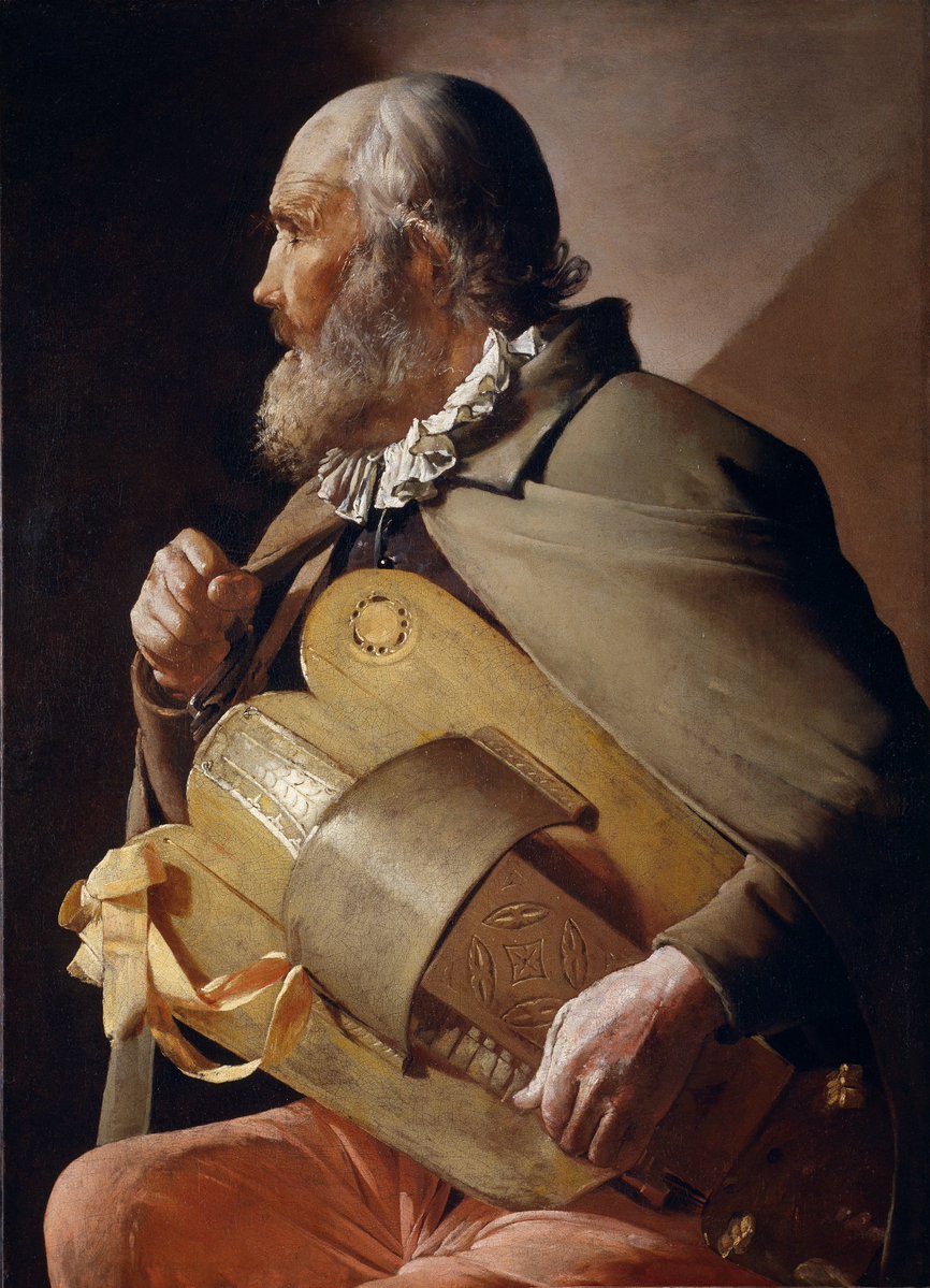 alt-text via model — "An elderly man is shown in strict profile facing left, his eyes closed to signal blindness, his mouth slightly parted as if singing along to his own playing. He has a bald, deeply creased pate, wisps of grey hair, and a full grey-white beard rendered in loose, animated brushwork. He wears a pleated white ruff collar and a heavy grey-green cloak over dark clothing, with salmon-pink breeches visible at the lower edge. He plays a zanfona (hurdy-gurdy), its honey-coloured wooden body slung from a strap around his neck; his left hand grips the crank at the instrument's upper end while his right rests on the keybox, its carved rosette sound hole and tooled leather/wood ornament visible, with pale yellow ribbon streamers hanging loose at the lower bout. The figure is picked out by a single raking light source against a warm, deep-shadowed ground that pales to dusty rose in the upper right — characteristic of La Tour's Caravaggio-derived tenebrism."