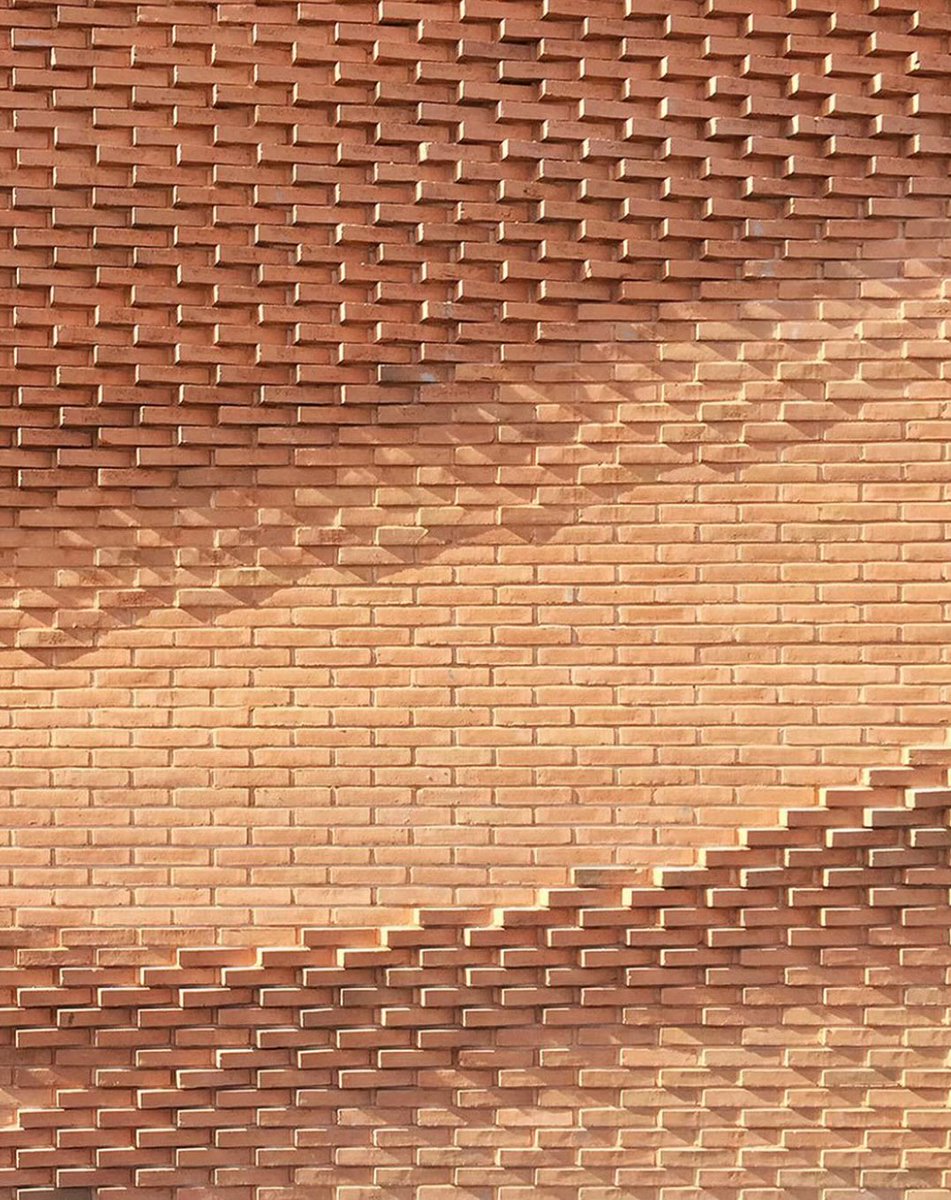 david_perell's tweet photo. People say it’s too expensive to build things beautifully, but look at all the beautiful things you can do with bricks.

Effort and creativity are the ultimate constraint, not money. 

And the extra work is worth it because life is so much lovelier and more delightful when our streets are filled with craftsmanship.