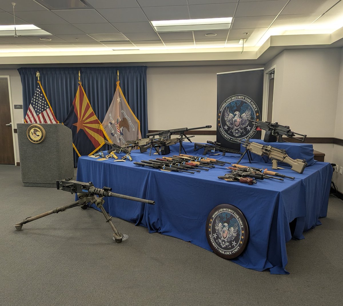FBIPhoenix's tweet photo. Yesterday, FBI Phoenix stood in support of our federal partners to announce a 158-count indictment of 28 individuals charged with firearms offenses after a coordinated investigation through the Homeland Security Task Force (HSTF).

Crime doesn't stop at the border and neither do we.

Read more: https://t.co/MGeubSzUL8