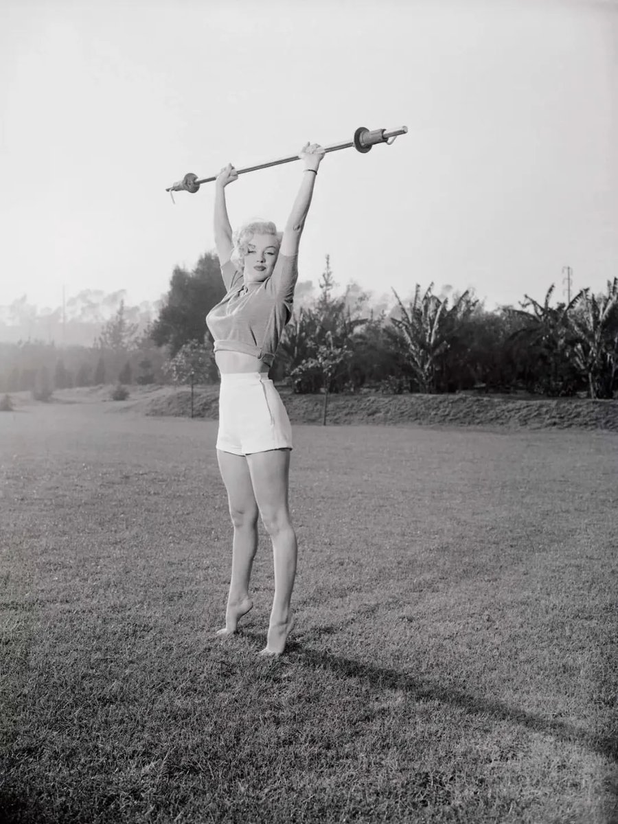 historyinmemes's tweet photo. Marilyn Monroe photographed by Philippe Halsman for LIFE magazine in 1952.

Hollywood glamour often masked the intense physical discipline required behind the scenes. Studio publicity emphasized elegance and beauty, rarely drawing attention to the strength and conditioning that many actresses relied on to meet the demands of their careers.

Magazine features like these helped challenge those perceptions. By showing major stars training with weights, they revealed that serious fitness and athleticism were an essential part of succeeding under the relentless demands of the Hollywood spotlight.