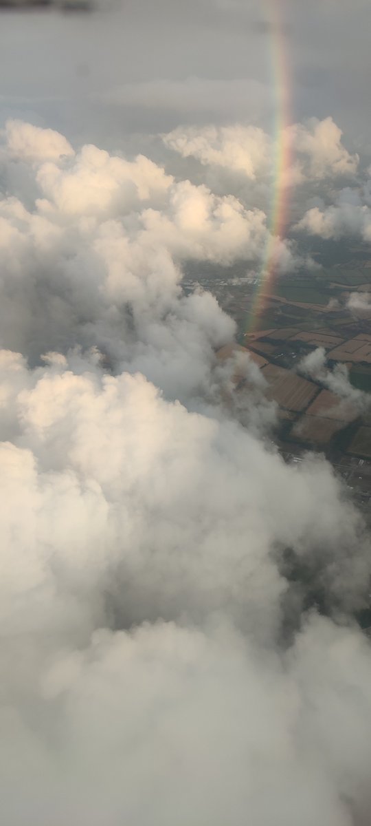 luxl0ss's tweet photo. photo i took from the plane much earlier. rainbow. yay https://t.co/1XfuOIi6Ij