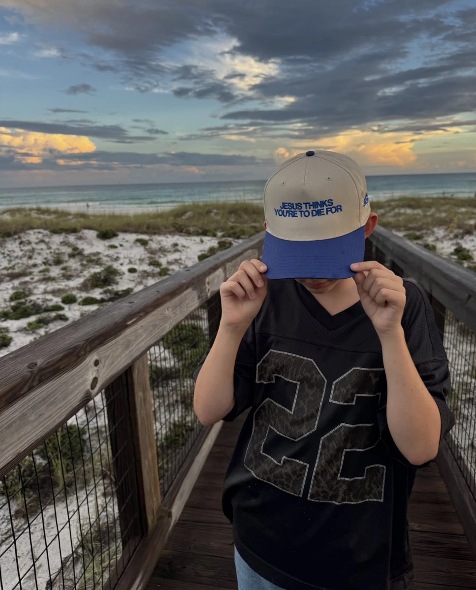 robbystarbuck's tweet photo. I have to dad brag real quick. My 13 year old son blows my mind. He used his own money from odd jobs to start a clothing brand. Won’t take any help from us. Figured out his supply chain, did his own designs, built his own site, does his own packaging and shipping, personalizes everything, did deals with influencers that I have no connections to and does all his own photos/videos and marketing.

Kid is shipping product on the regular. Worked out every problem that came up by himself. Pushed himself at every turn where someone else would give up. To say I’m proud would be an understatement.

His site: https://t.co/8atcYqVu0F

Just go look at his site and tell me this isn’t crazy for a 13 year old to do on his own. Attached are some of his marketing materials. Today he launched their new hats to spark conversations about Jesus. So… seriously how did this amazing kid come from me???