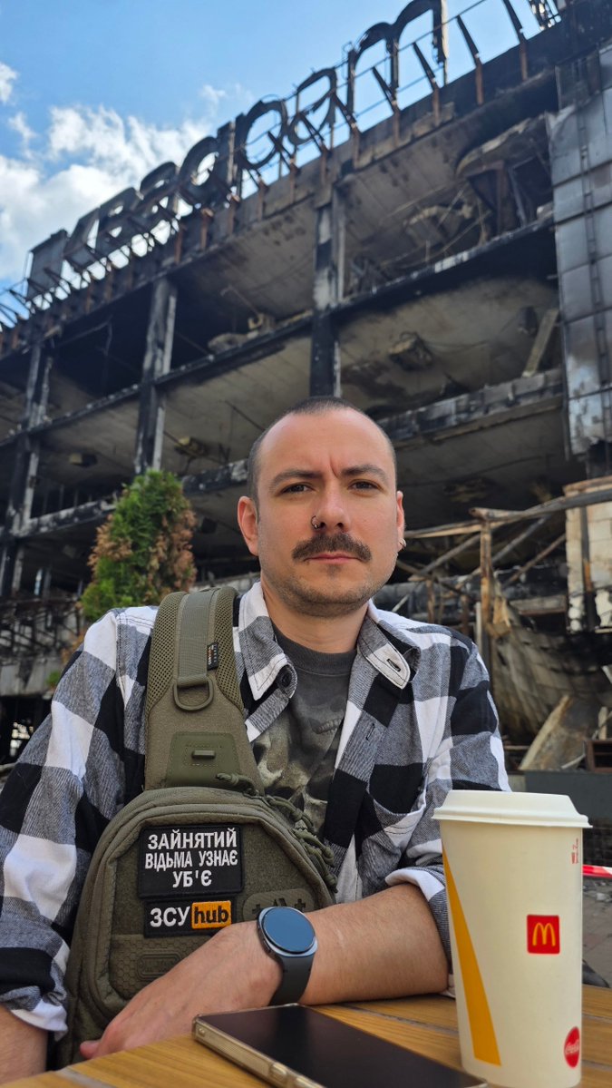 Xenta777's tweet photo. My son sent me these photos from Kyiv before returning to his military unit
This is the Lukianivka McDonald's, damaged by russian missile attacks many times but repaired every time
Behind him is the burned-out Kvadrat mall, destroyed in a russian missile attack on May 24, 2026 https://t.co/brcqxvUnx7