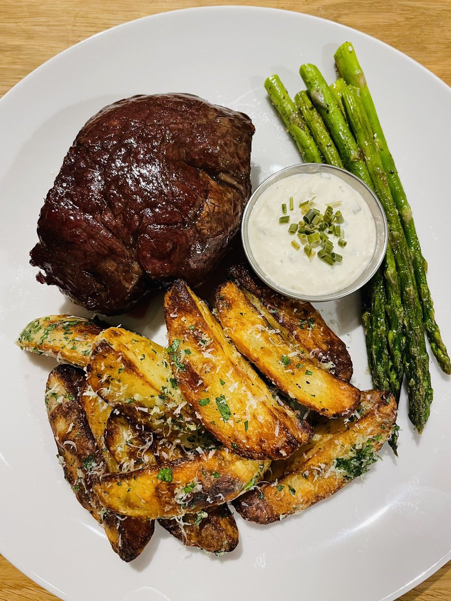 coookwithchris's tweet photo. How to make a perfect steakhouse dinner at home:

Filet:

-Pre heat the oven to 275
-Season well with salt, then place on a baking rack (so it cooks on all sides)
-Bake until it is about 7-8 degrees off of your desired temperature (should be about 30-45 minutes depending on your desired temp)
-For example, I wanted mine to finish at about 125-127 internally, so I removed it from the oven at about 118-20
-Sear over high heat 1 min per side in ghee or tallow
-When you flip it, add butter, garlic, and rosemary and give it a quick baste
-Let rest for 5-10 mins and enjoy!

Horseradish sauce:

Ingredients:

-1/2 cup sour cream
-2 tbsp prepared horseradish, drained
-2 tbsp avocado mayo
-1 tsp apple cider vinegar
-Salt
-Black pepper
-1 tbsp fresh chives, finely diced

Combine all ingredients, then taste for salt and vinegar and adjust to taste.

Roasted parmesan truffle fries:

-Slice some russet potatoes into 4 wedges
-Soak in some cold water (or at least rinse well) then pat dry
-Toss in some olive or avocado oil, salt and pepper
-I use the roast setting on the air fryer, but you can also use the oven. 40 minutes at 400 degrees, giving them a stir every 10 minutes so all sides get crispy
-Since all ovens/air fryers cook differently, keep an eye on them
-When done, toss them in a bowl with parsley, freshly grated parmesan and truffle oil (picture of the brand I like below)

Asparagus:

-Simply heat some tallow, butter or oil over medium heat on a pan with a few whole, smashed garlic cloves
-Cook gently until your desired texture
-Season with salt and pepper and enjoy!