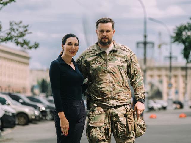 HavryshkoMarta's tweet photo. So, I take it this intimate photo of @LauraLoomer  with the Great White Chief, Andriy Biletsky, means he finally managed to convince her that the insignia of one of the units in his Azov-rooted Third Assault Brigade has absolutely nothing whatsoever to do with the symbol of the Nazi Dirlewanger unit—and that any resemblance is, of course, purely coincidental🤫