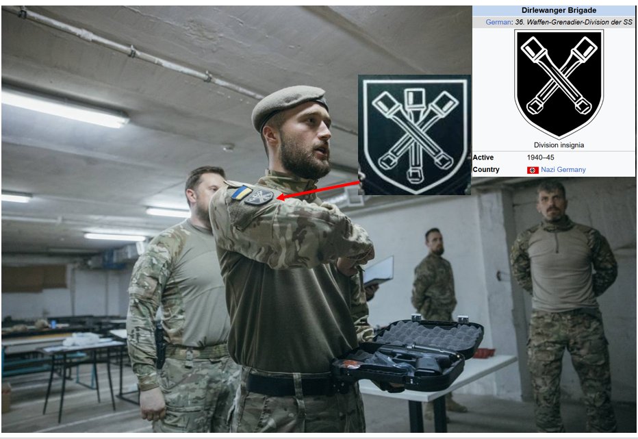 HavryshkoMarta's tweet photo. So, I take it this intimate photo of @LauraLoomer  with the Great White Chief, Andriy Biletsky, means he finally managed to convince her that the insignia of one of the units in his Azov-rooted Third Assault Brigade has absolutely nothing whatsoever to do with the symbol of the Nazi Dirlewanger unit—and that any resemblance is, of course, purely coincidental🤫
