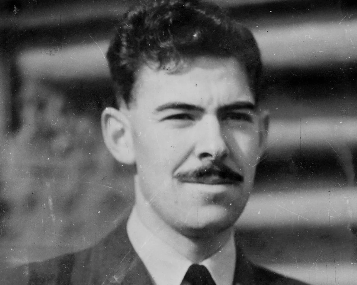 VoicesofWW2's tweet photo. Seventy-two. That is how many separate wounds John Cruickshank had in him, two of them through his lungs, while he lined up a burning flying boat for a second run at a U-boat that had just shot his aircraft to pieces. Most men have one of those wounds and they are finished. He had seventy-two and he pressed the attack.

He was 24, a former bank clerk from Aberdeen, flying a Catalina flying boat out of the Shetland Islands with Coastal Command. The job was the long, freezing, mind-numbing patrol, fourteen hours over the grey Atlantic hunting the U-boats that were strangling Britain. On the 17th of July 1944, far out over empty water, they caught one on the surface, U-361, and Cruickshank took the big slow flying boat down to attack.

The first run failed. The depth charges would not release. Any sane man makes a note and turns for home. Cruickshank swung the aircraft around and came back for a second pass, low and straight, and this time the submarine's gunners were waiting. Flak ripped through the Catalina. It killed the navigator, wounded half the crew, and tore into Cruickshank again and again, those seventy-two wounds, two punching into his lungs, ten into his legs.

And he flew the attack home anyway. Bleeding everywhere, in agony, with the fuselage holed and on fire, he held the aircraft dead level, aimed, and released the depth charges himself. They straddled the U-boat perfectly. It broke apart and sank beneath him.

Then came the part that should have killed him. He collapsed from blood loss, and the wounded co-pilot, who had never landed a Catalina, took the controls for the long flight back. Cruickshank refused the morphine that would have knocked him out, because he knew the man flying needed him. Drifting in and out, he had himself carried back up to the cockpit again and again through the night to help nurse the shot-up aircraft down, and at dawn they got it onto the water safely. He had lost so much blood the doctors said he had no business being alive.

He lived. He took the Victoria Cross from the King, went quietly back to banking after the war, and rarely spoke of it. And he kept on living, and living, and living. John Cruickshank died in 2025 at the age of 105, the last man on earth wearing a Victoria Cross earned in the Second World War. Seventy-two wounds over the Atlantic, and he outlasted every other hero of that war by decades.
