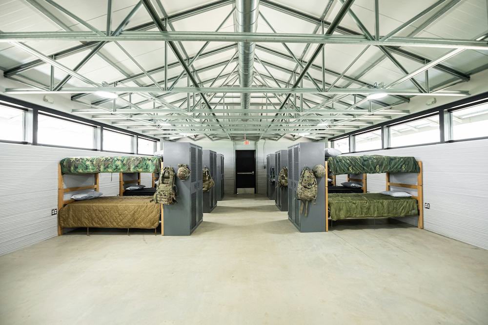 Osint613's tweet photo. A fleet of robotic 3D printers has completed the first of ten U.S. Army barracks at Fort Bliss, marking the largest automated construction project ever undertaken by the U.S. military. https://t.co/yMhLZ5NrIz