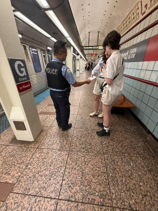 CPDTransit's tweet photo. Public Transportation Section Officers at Grand redline conducting safety awareness outreach for the ridership. @Chicago_Police @CPD_BCT https://t.co/WKhl8ZOVCU