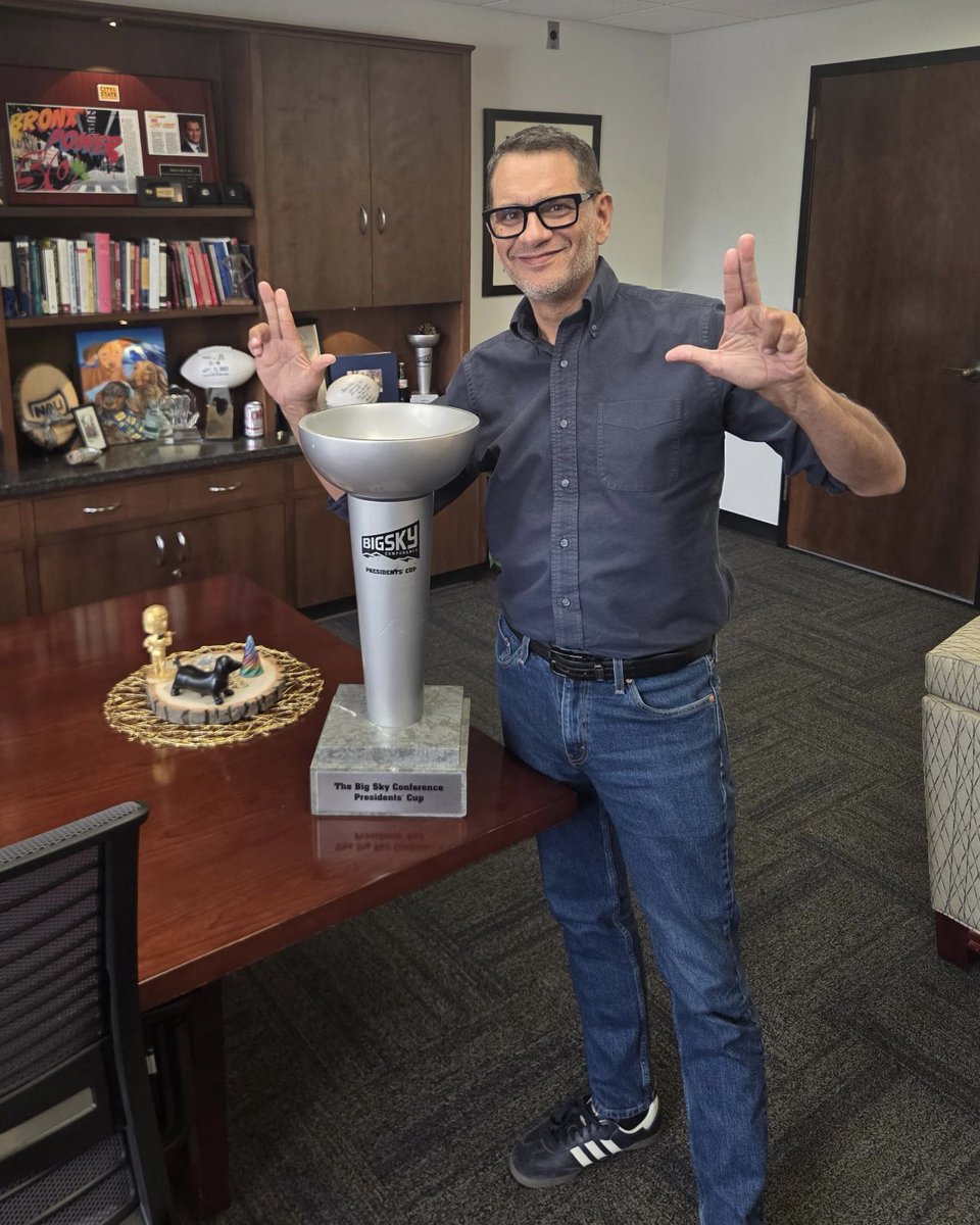 NAUAthletics's tweet photo. The trophy looks great with President Cruz Rivera!
#RaiseTheFlag https://t.co/ar8B7Hs6i2
