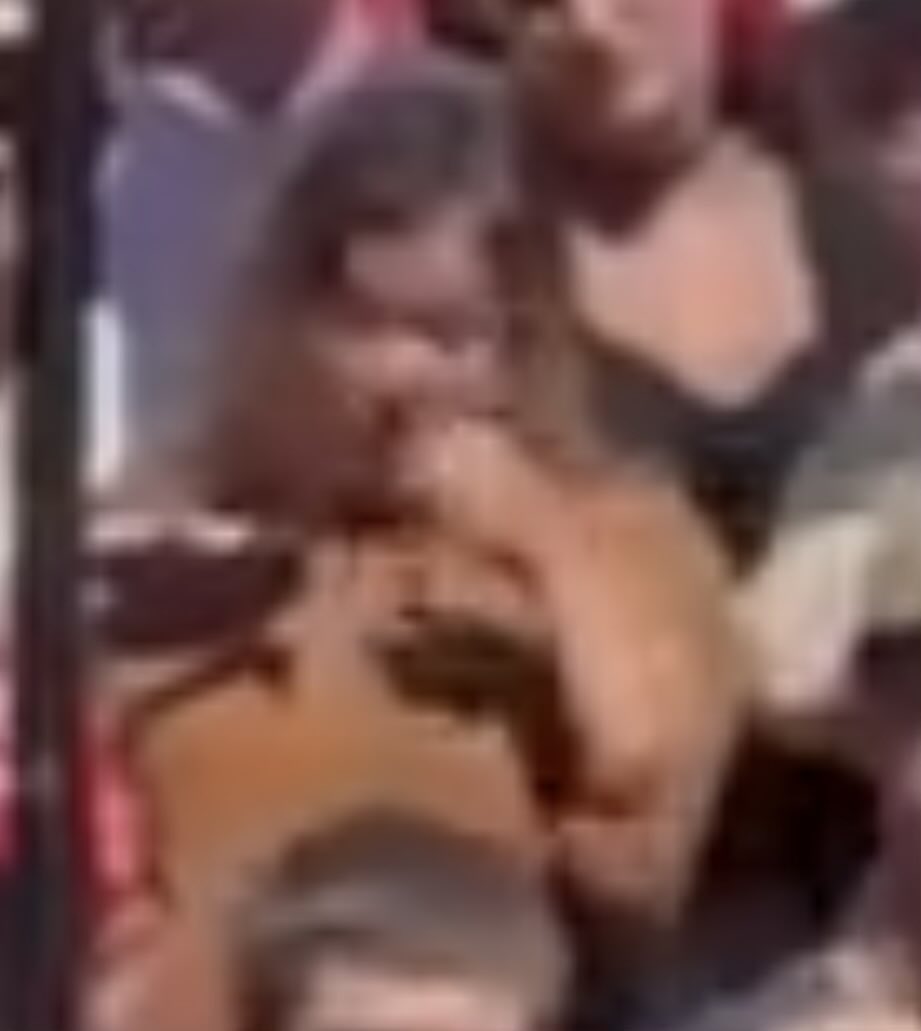 Reframedq3's tweet photo. @Mark93541946 This woman has something in left hand that she conceals. https://t.co/sJR63b1mUk