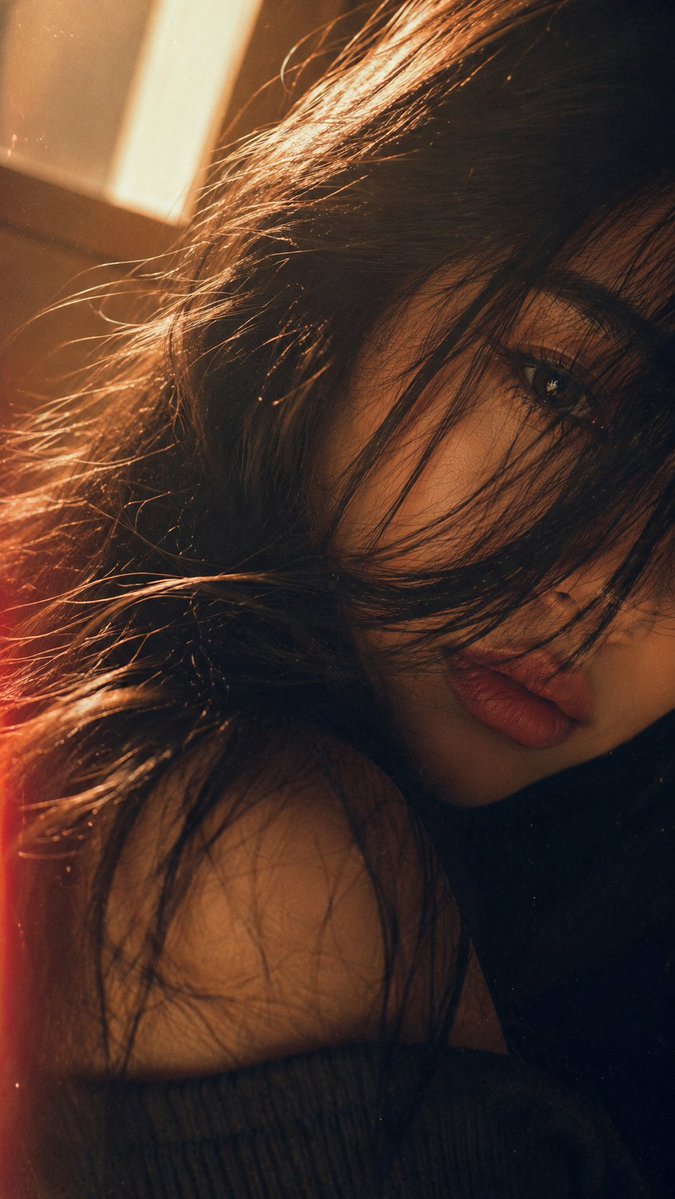 MissDelulu9's tweet photo. GPT Image 2 on ChatGPT 

Prompt:
Create a portrait without changing my facial features. A close-up portrait of me, with only one eye visible, peeking through long, voluminous wavy hair falling across the face. The eyelashes catch a warm golden glow from the sunlight. Flawless makeup, dusty rose lips, and naturally tanned, smooth skin. 

The rest of the face is softly blurred and cropped out of the frame. A vintage film aesthetic, a slight tilt, and warm golden light leaks create a nostalgic atmosphere. The skin appears smooth and refined.
Aspect Ratio: 9:16