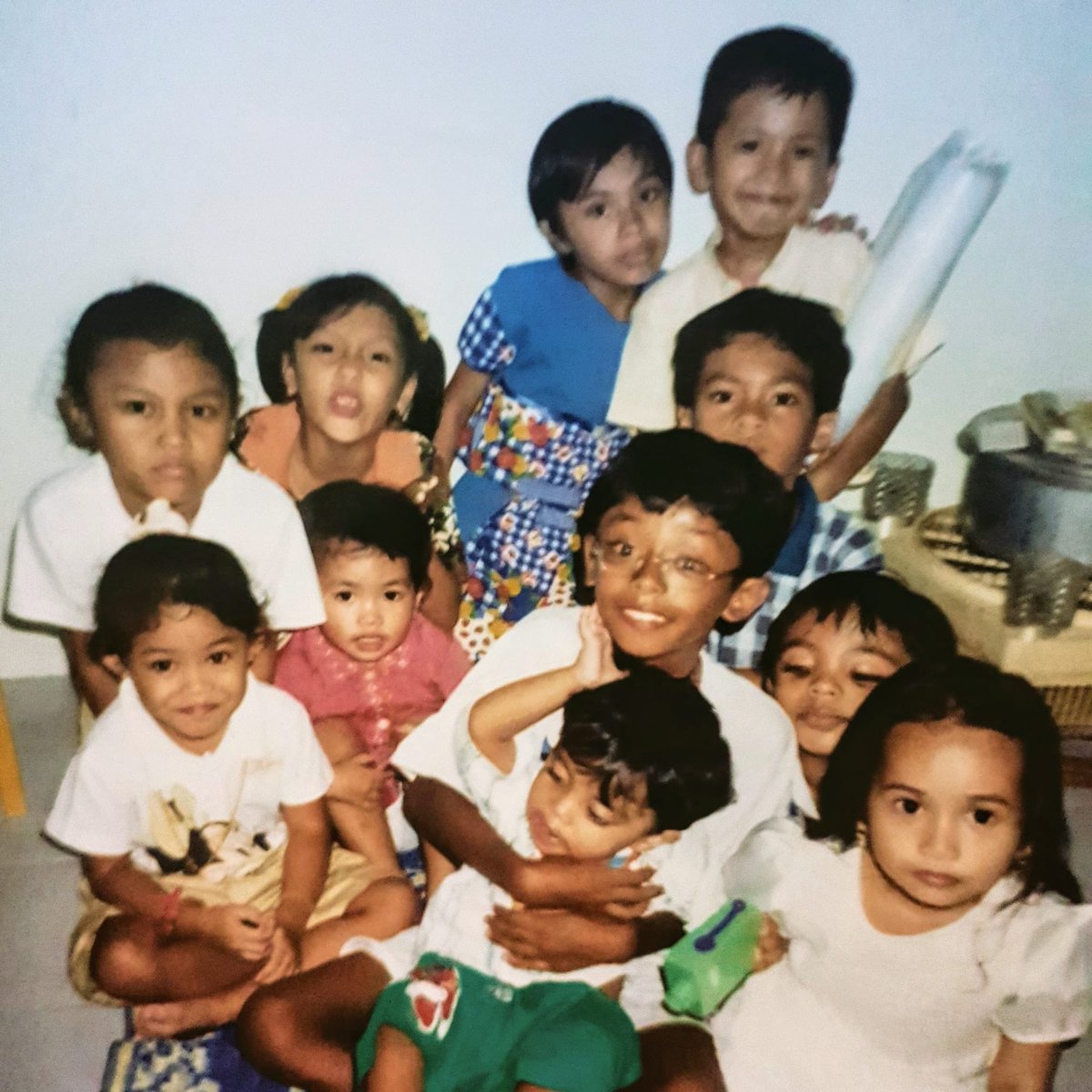 s4b44i's tweet photo. In Bandung again and this place reminds me of childhood 🌴🍃🥹🩵 and coincidentally my mum sent me this photo of us at the right timing hahaha. My cousins, nieces and nephews. My nieces and nephews are older than me or around the same age 😂 https://t.co/dFV2GxNq8T