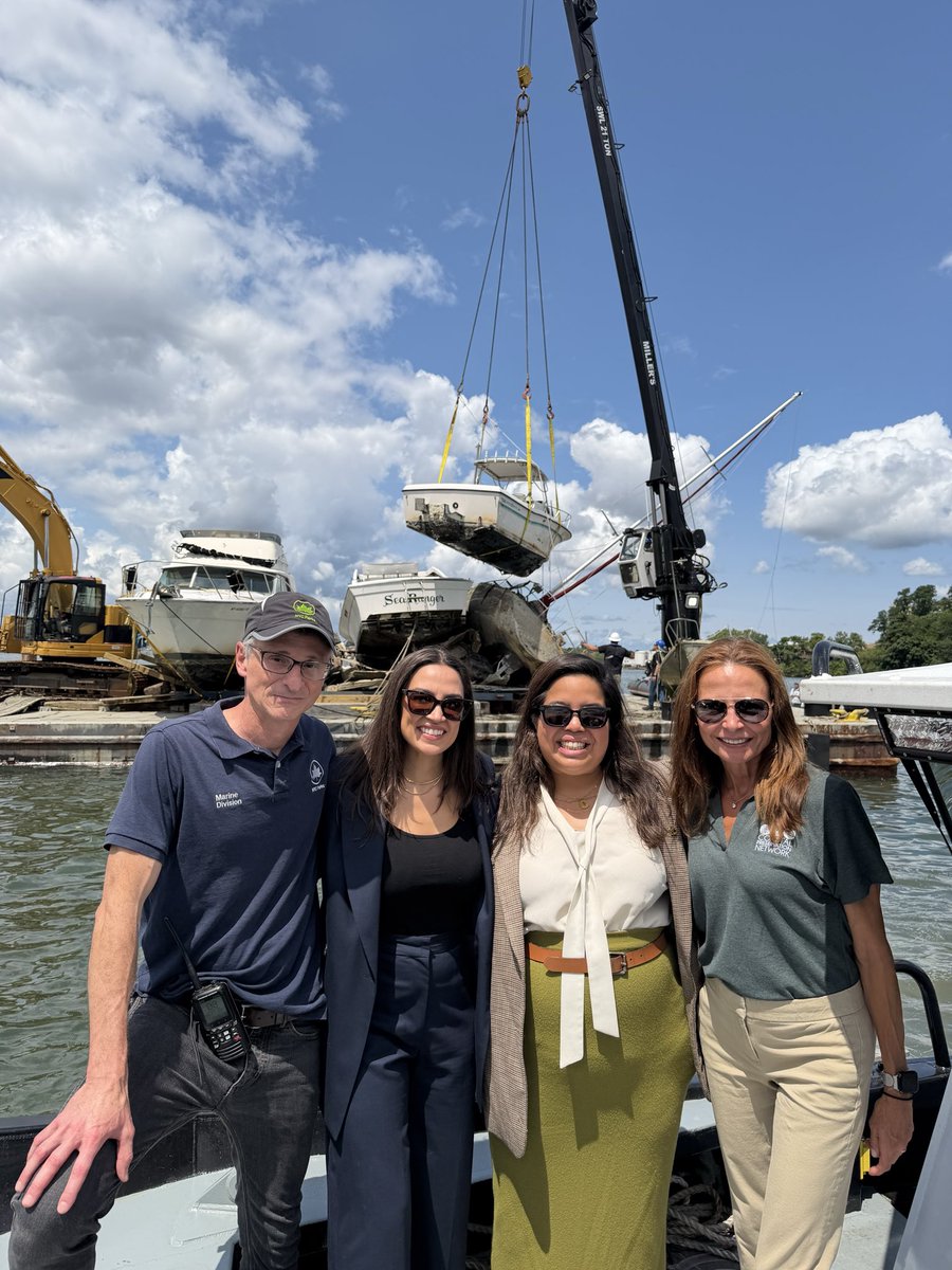 RepAOC's tweet photo. Yesterday, I joined @NYCParks in College Point to observe the removal of abandoned vessels and debris in Flushing Bay. 

I’m proud to have secured over $1 million in federal funding to advance their critical work to restore our community waterways. https://t.co/74qW9At8Fc