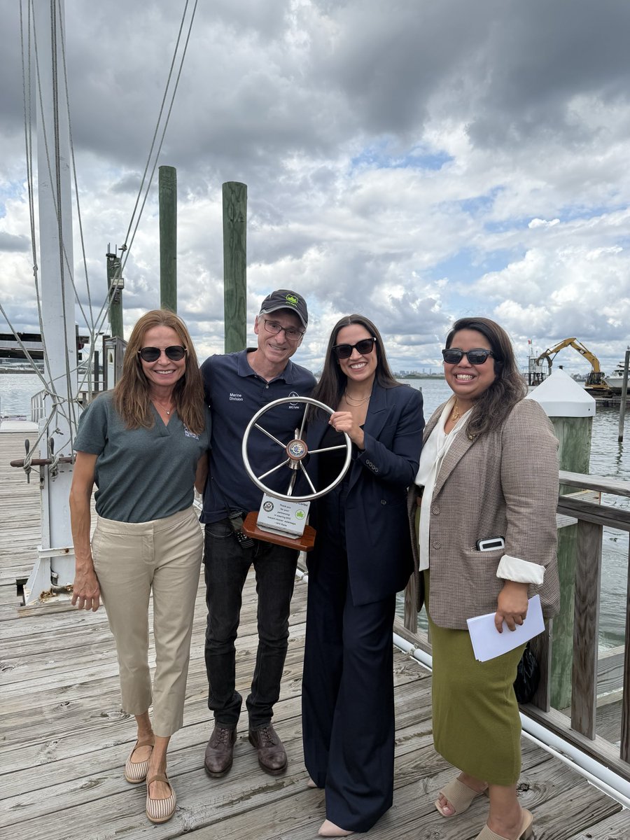 RepAOC's tweet photo. Yesterday, I joined @NYCParks in College Point to observe the removal of abandoned vessels and debris in Flushing Bay. 

I’m proud to have secured over $1 million in federal funding to advance their critical work to restore our community waterways. https://t.co/74qW9At8Fc