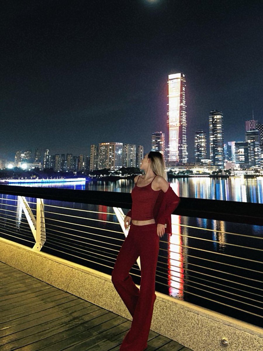 SilentHaltca0's tweet photo. City lights flickering under the moon, red dress against the night sky like a love letter meant just for tonight. The moment the shutter clicked, every light landed exactly where it should, and even the breeze felt right ❤️🌃 https://t.co/hi5J2jAzBf