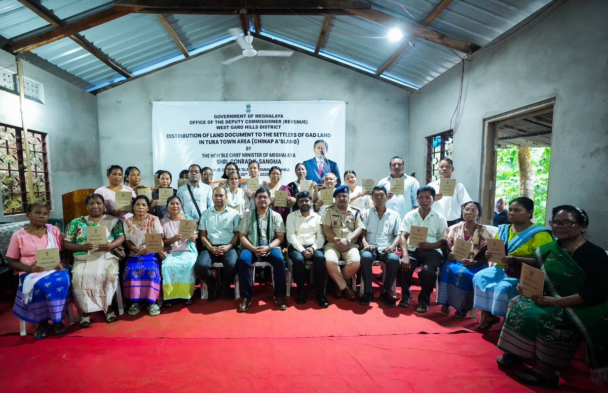 SangmaConrad's tweet photo. Pleased to hand over land pattas to families of Chinap A’slang, marking an important step in resolving the decades-long issue of GAD land occupation in the Tura Town area.

Families who received the document can find security especially in availing loans, necessary certifications, government schemes and services, etc. 

The programme covers 754 households across eight localities in Tura Town. From just 42 households depositing the required premium in December 2025, the number has now grown to 210, with 127 land pattas ready for handover. 

In Chinap A’slang alone out of 93 households, 25 have completed their deposit and have received the documents today.